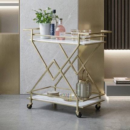 Designer gold serving trolley cart with marble finish shelves and wheels for luxury home decor